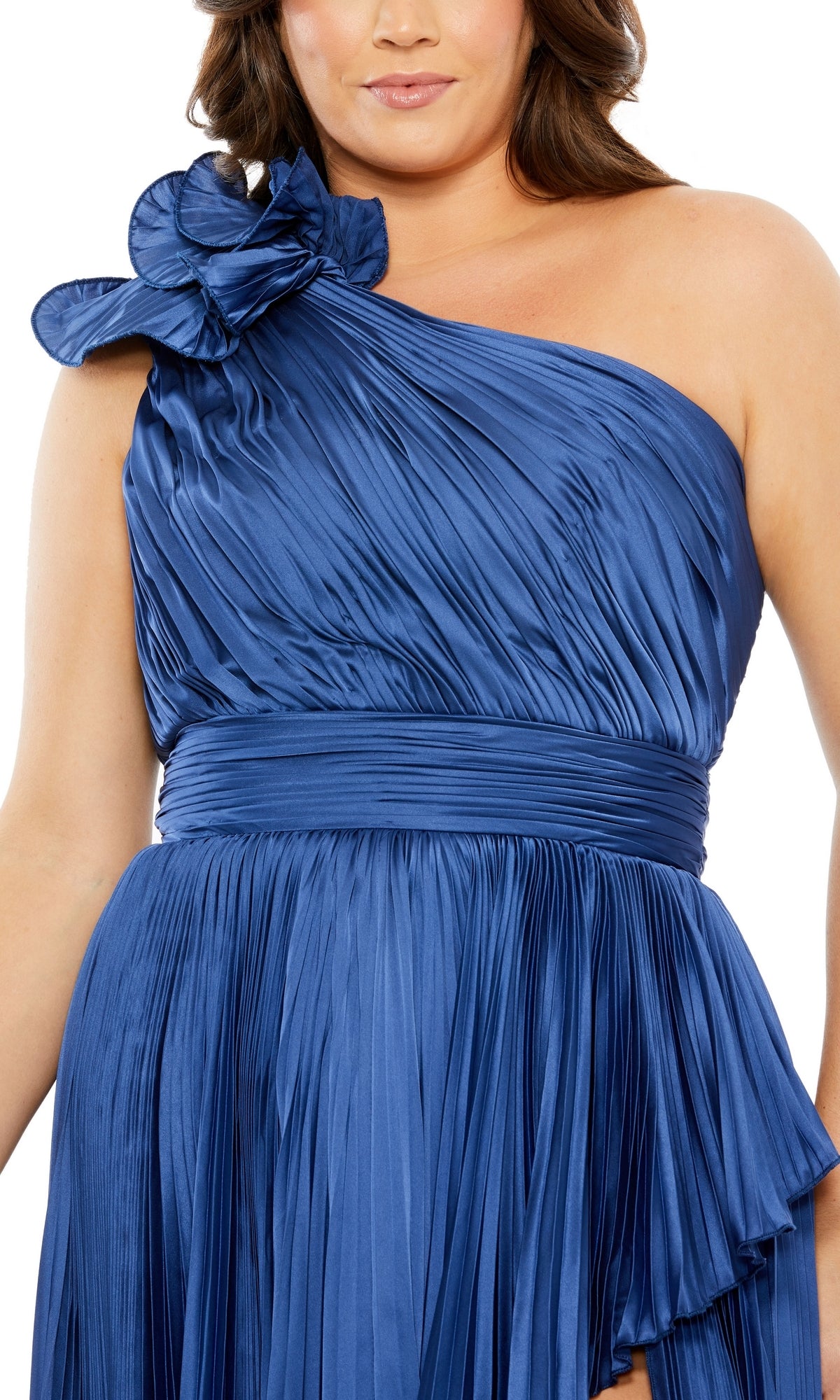 A person wearing the Mac Duggal Long Plus-Size Formal Dress 77003, a royal blue one-shoulder gown with pleats and a large ruffle detail—an elegant choice for formal occasions.